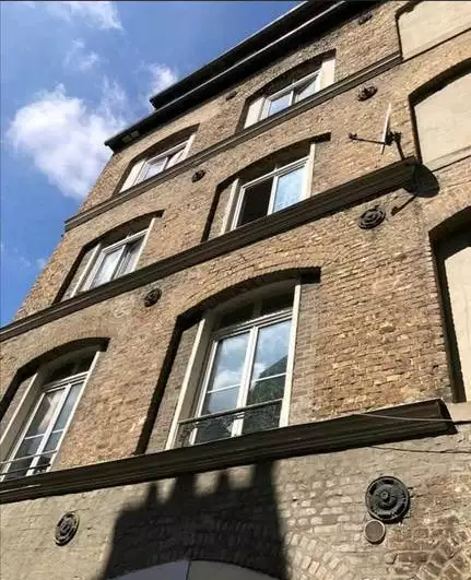 Old buildings with many apartments in Elbeuf, France
