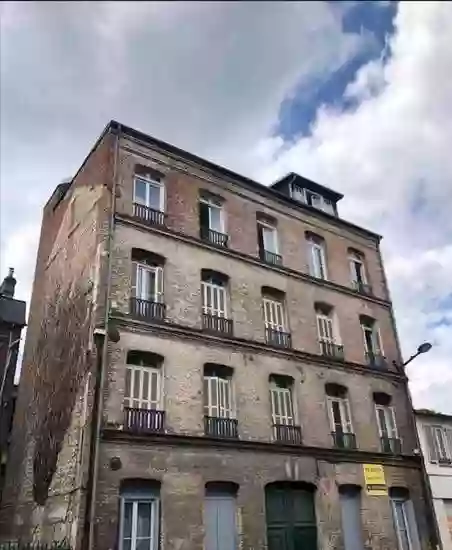 Old buildings with many apartments in Elbeuf, France
